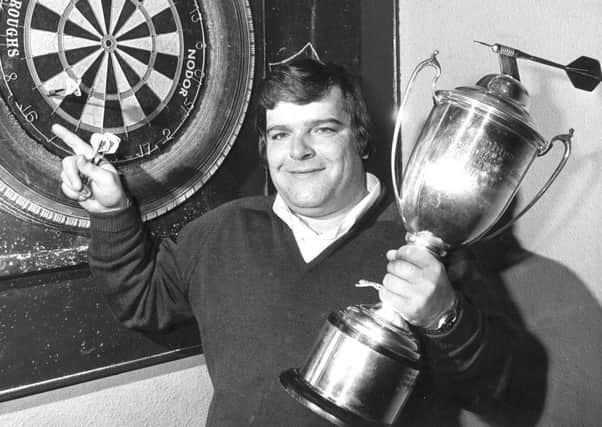 Jocky Wilson in Kirkcaldy with the Embassy Darts World Championship trophy in 1982