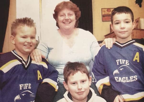 Jean Summers with her son Matthew (bottom) and Fife Eagles players Bruce Davidson (left) and Michael benvie (right).