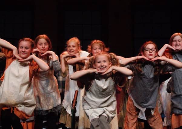 The cast of Annie Jnr in action. Pic: Hannah Wilson.