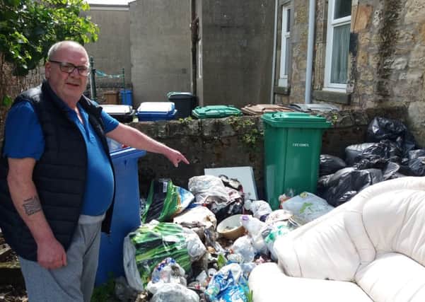 James Irvine has been complaining about the refuse, which he claims was dumped by his former neighbours in a communal garden in Kirkcaldy, for a long time.