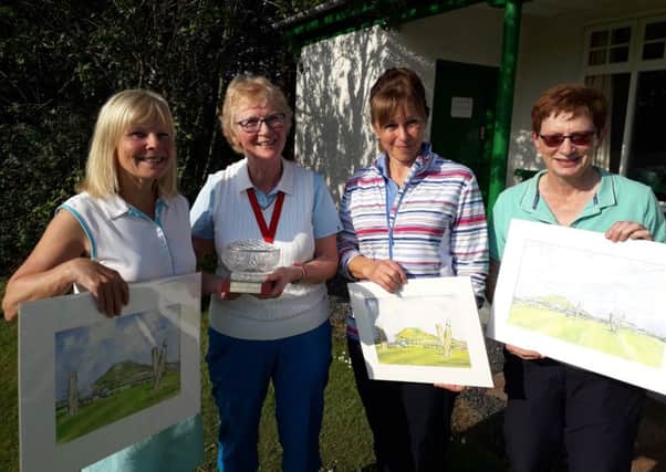 Sue Nicholson 18 hole winner, Captain Linda Mould, Frances McIntosh, RU 18 hole, Elaine Brunton 9 hole winner receiving their beautiful hand painted pictures of the Standing Stones by local artist Lesley Clark.