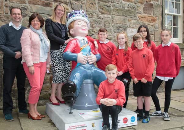 From left: Stephen Gethins MP; Debbie MacCallum, chair of Tourism St Andrews; Dr Katie Stevenson, assistant vice-principal (Collections and Digital Content) at the University of St Andrews, and primary 7 pupils from Lawhead Primary. Pic: ASM MEDIA & PR.