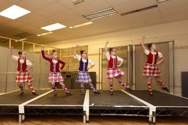 Due to the heavy rain forecasted, the Highland dancers were moved indoors to the Mercat Shopping Centre. Pic credit- WALTER NEILSON.