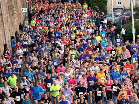 Runners pack the streets of Kinghorn in a previous Black Rock 5 gathering. Pic: Fife Photo Agency