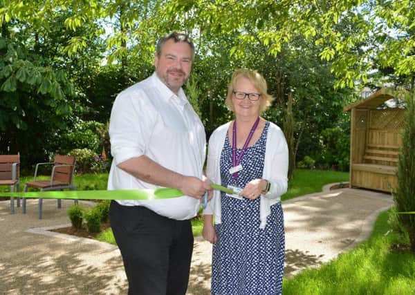 New garden at Victoria Hospice, Kirkcaldy - Darrian Wilson opens the garden with Fiona Mackenzie, Clinical Services Manager