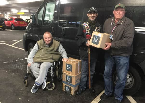 Hampers for veterans...are delivered by breakfast club founder Mike Boyle (left) and volunteer Maurice Parkyn (right) pictured here with a local veteran.