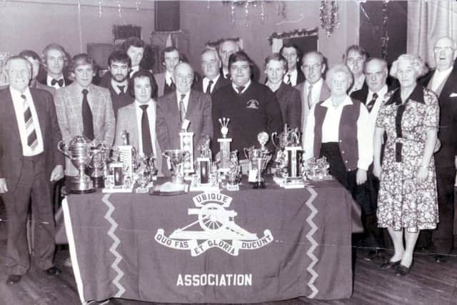 Jocky Wilson presents the annual trophies to winners and runners up at Christmas 1990