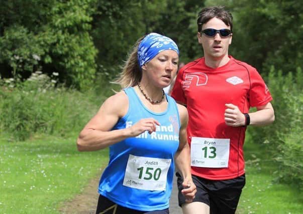 Judy Turner on way to winning the women's category at the Benarty Trail Race (Photo-Gordon Donnachie).
