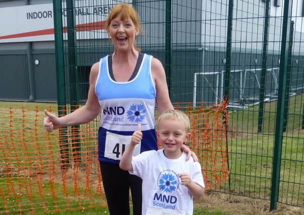 Karen Richards with her nephew Gregor Laing at Glenrothes Running Festival, raising publicity for Karens ultra-marathon attempt on behalf of MND Scotland.