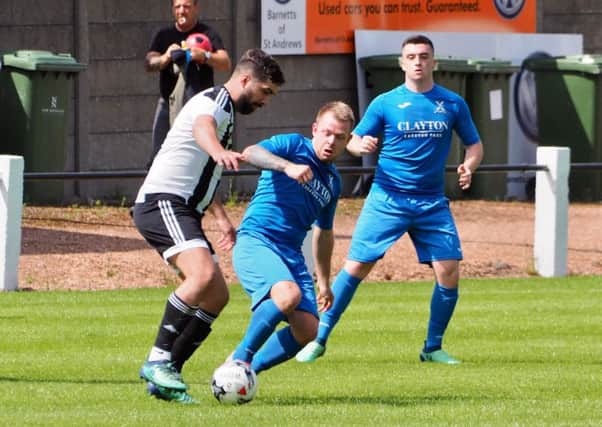 Ryan McInnes  is in the thick of the action for Saints in their hard fought game with Dunbar. Picture by Blair Smith.