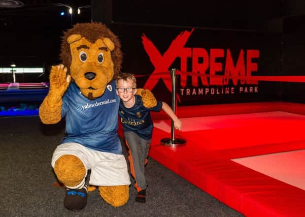 Roary Rover and a young fan promote the Roary's South Stand Shot, sponsored by Xtreme Trampoline Park in Glenrothes.