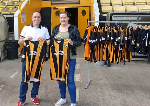 Chelsea and Ross from Fife SAMH Service choose  East Fife FC strips ahead of the event.
