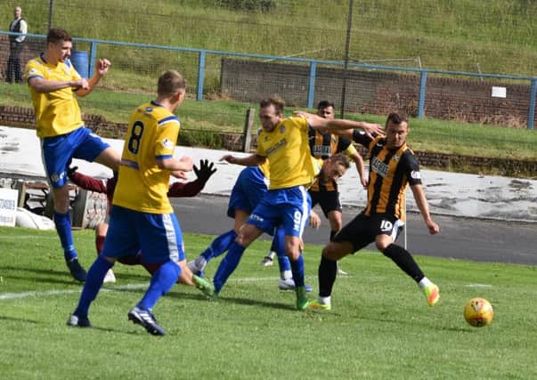 Kevin Smith comes up against the Cowden defence