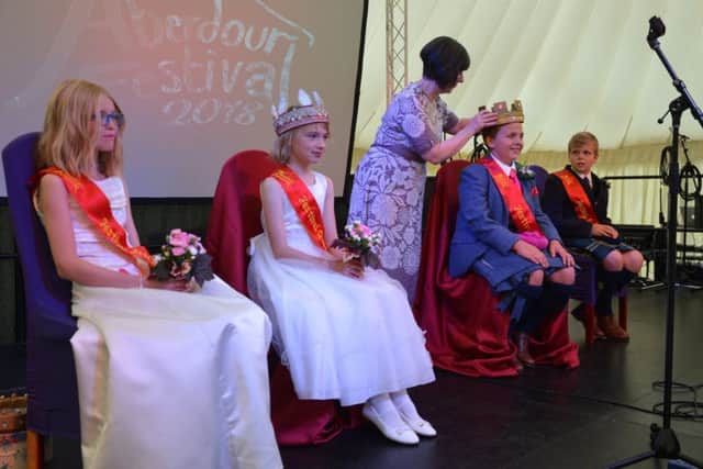 Lis McTaggart performed the crowning at the 2018 Aberdour Festival. She addressed the audience. From left rear: Attendant Maddy Phillips 11, Queen Zoe MacNulty 12, Myles Adam King 12, Peter Bryden attendant 12. Pic: George McLuskie.
