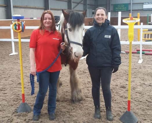 Frances Cape (right), of East Fife & Scooniehill Riding for the Disabled, with ExxonMobil employee Martha Cape.