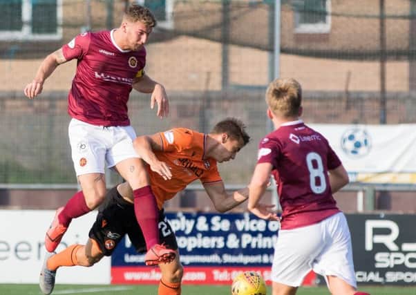 Louis comes under pressure from the Stenhousemuir defence in the Betfred Cup.