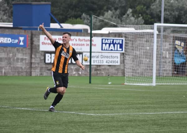 Aaron Dunsmore celebrates after scoring the winning penalty against Hearts (Pic by Kenny Mackay)