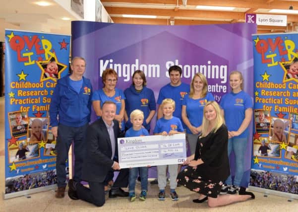 The team at Kingdom Shopping Centre presented a cheque to representatives of LoveOliver for £14,302.22.