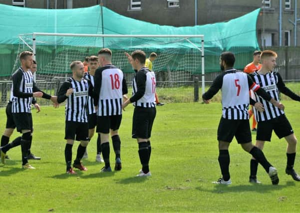 Newburgh celebrate after netting against Syngenta Juveniles. Pic by Graham Strachan.
