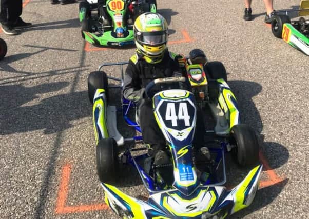 Taylor Thomson in his kart.