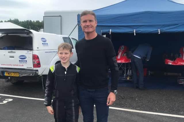 Kirkcaldy karter Taylor Thomson with F1 legend David Coulthard.