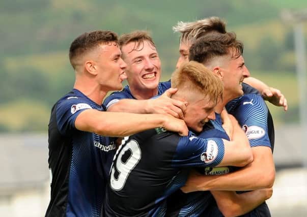 Raith Rovers - Grant Anderson mobbed by team mates after scoring - credit- Fife Photo Agency