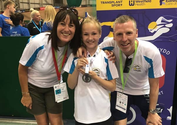 Rosie with mum Lisa and dad Alan.