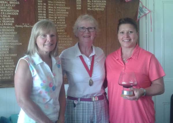 Handicap runner up Sue Nicholson  with captain Linda Mould and champion Pam Seath.