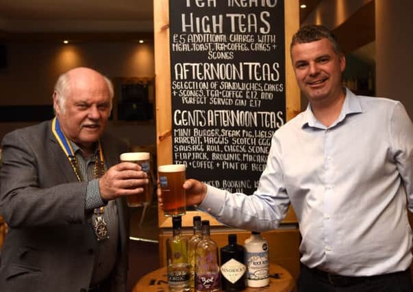 Jason Borthwick, owner of The Sands Hotel,  with Burntisland and Kinghorn Rotary President Ken Kirkwood promoting the Beer and Gin Festival in Burntisland. Pic: Fife Photo Agency.