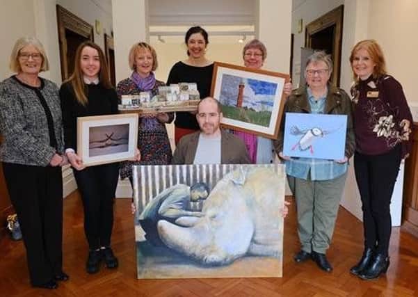 The handover of last year's winning artworks from the Fife Art Exhibition to NHS Fife.