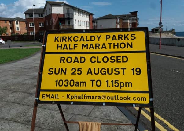 138 traffic signs informing Kirkcaldy residents of road closures in their area while the marathon is on have been erected throughout the town. Pictured is one at the entrance to Williamsons Quay at the harbour.