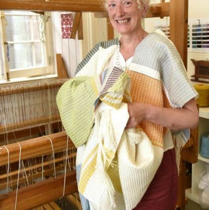 Weaver Susie Redman with five metres of woven fabric from her loom. Pic: Fife Photo Agency