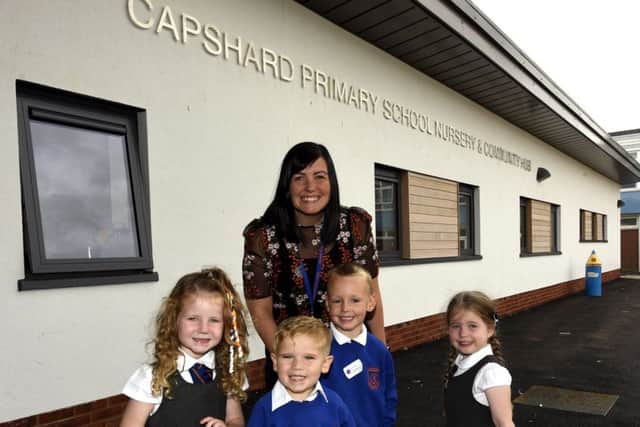 Jennifer Drummond,  DHT of  Early Years with P1 pupils Emily,  Ethan,  Lucas and Emily. Pic: Walter Neilson .
