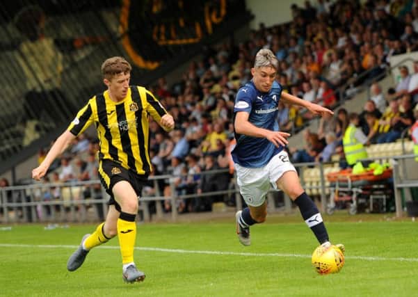 Dumbarton  v Raith Rovers - Bowie sprints away from Crawford - credit- Fife Photo Agency