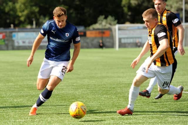 Jamie Gullan, the scorer of Raith's second goal, takes a run at the East Fife defence.