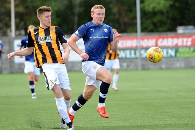 Lewis Allan pounces as Ross Dunlop is short with a pass back.