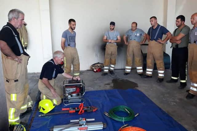 Jake Anderson helps to train crews in need in Vau i Dejes. Pic: SWNS