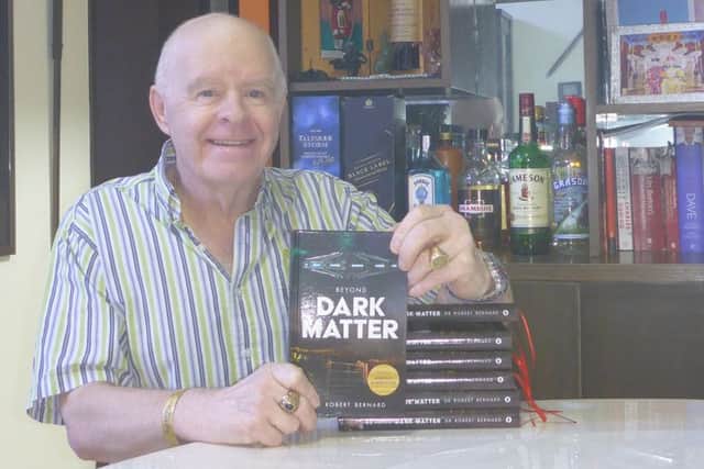 Dr Robert Bernard with his new book Beyond Dark Matter.