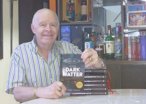 Dr Robert Bernard with his new book Beyond Dark Matter.