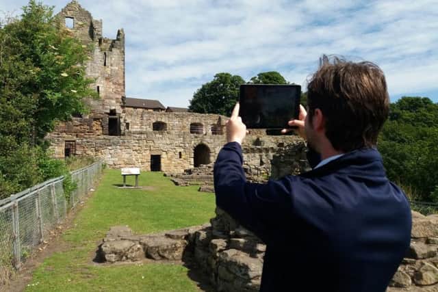 John Murray demonstrates the app at Ravenscraig Castle