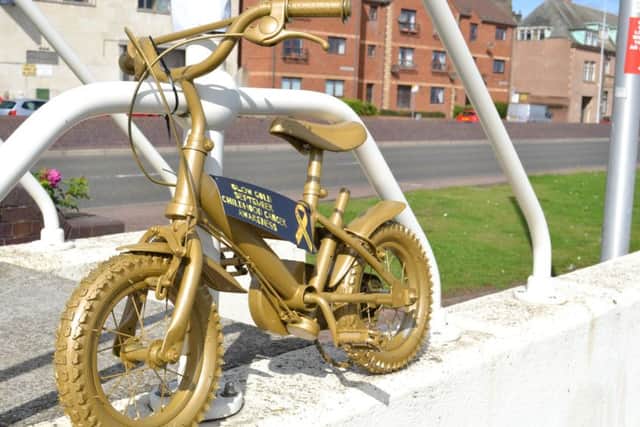 One of the spray-painted gold bikes on the Esplanade.