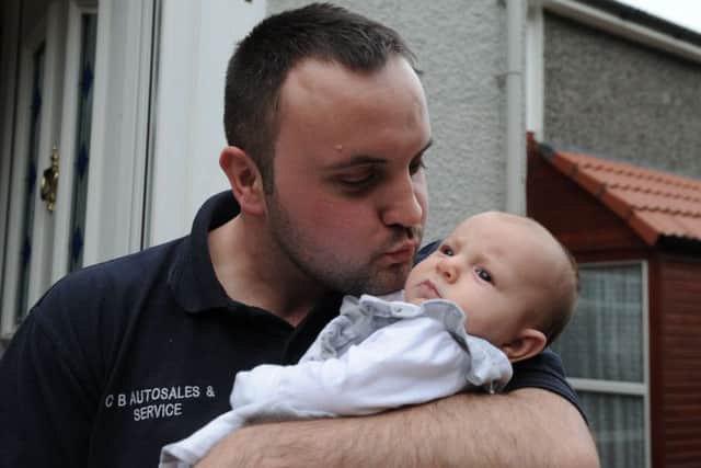 Calum Stewart with his special delivery - baby girl Hannah. Pic copyright: George McLuskie.