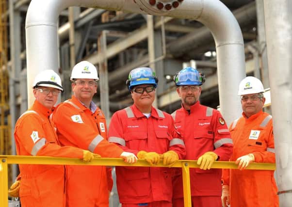 From left, Martin Beale, regional operations director (Bilfinger UK);  Alex Curr, COO (Bilfinger UK),  Jacob McAlister, plant manager (ExxonMobil), Jeroen Koutstaal, maintenance manager (ExxonMobil) and Ian King, site manager (Bilfinger UK).  Pic: Walter Neilson