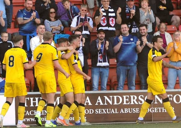 Excelsior Stadium - Airdrie - 
Airdrie v Raith  - Raith players celebrate ANDERSON goal in front of fans -
credit- Fife Photo Agency