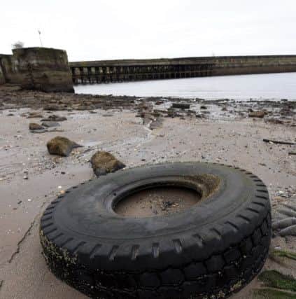 A tyre washed up on the beach at Kirkcaldy Harbour (Pic: Fife Photo Agency)