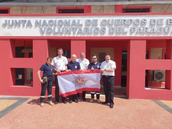 A team from International Fire and Rescue Association are on a mission in Paraguay.  Fraser Watson, from Kirkcaldy, is second from the left.