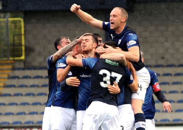 Danile Armstrong is mobbed after scoring the equaliser for Raith Rovers (Pic by Fife Photo Agency)