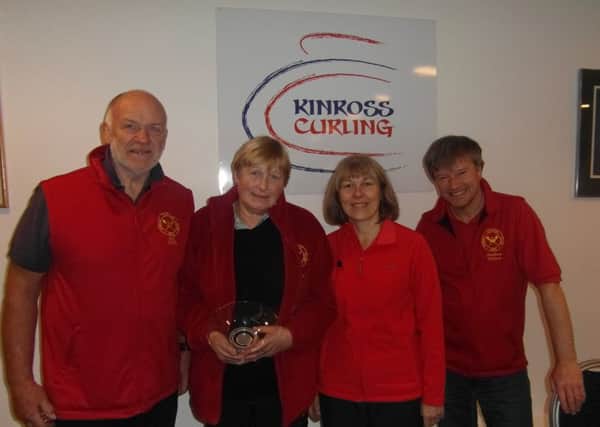 Vice president Andrew Wilson with the winning rink of Katie Duncan, Pat Hughes and Bill Rollo.