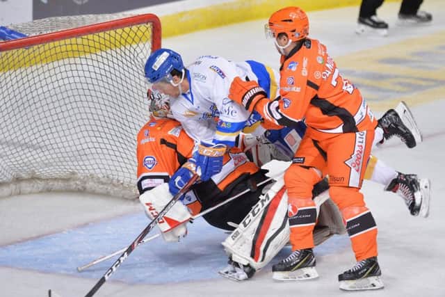 Paul Crowder collides with Sheffield Steelers netminder Tomas Duba. Pic: Dean Woolley