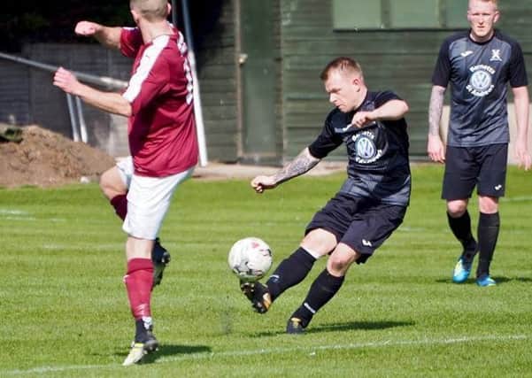 Ryan McInnes launches the ball forward for Saints. Pic by Blair Smith.